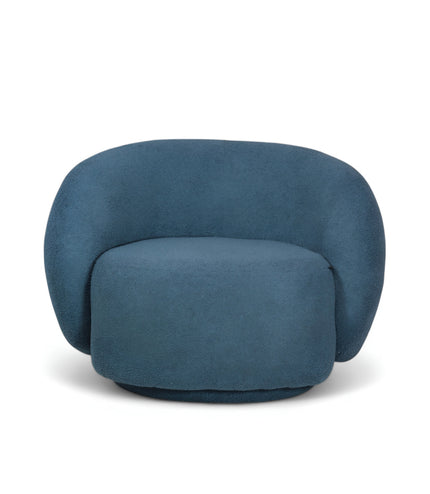 Deep blue boucle Cloud Armchair with a rounded, armless design and swivel base, offering a plush, sculptural look from front and angled views.