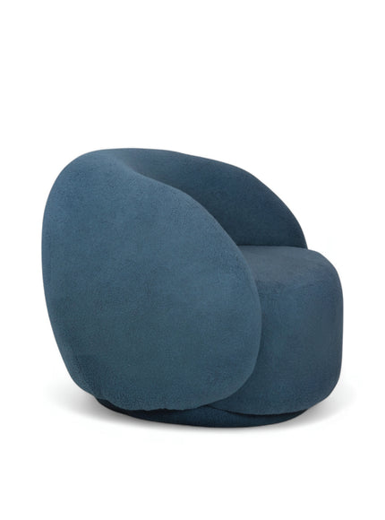 Deep blue boucle Cloud Armchair with a rounded, armless design and swivel base, offering a plush, sculptural look from front and angled views.