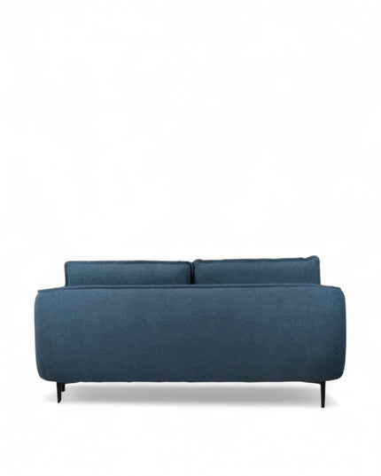 Cobalt Sofa in boucle-style blue fabric with slim black metal legs, rounded arms, and two patterned accent pillows, shown from front view and close-up fabric detail.