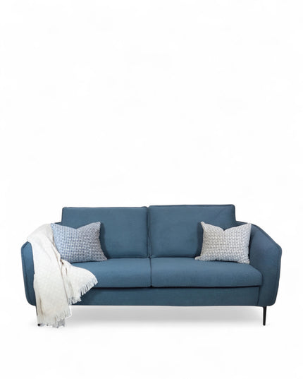 Cobalt Sofa in boucle-style blue fabric with slim black metal legs, rounded arms, and two patterned accent pillows, shown from front view and close-up fabric detail.
