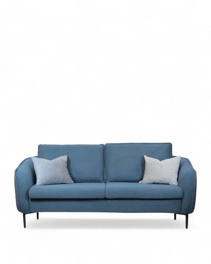 Cobalt Sofa in boucle-style blue fabric with slim black metal legs, rounded arms, and two patterned accent pillows, shown from front view and close-up fabric detail.