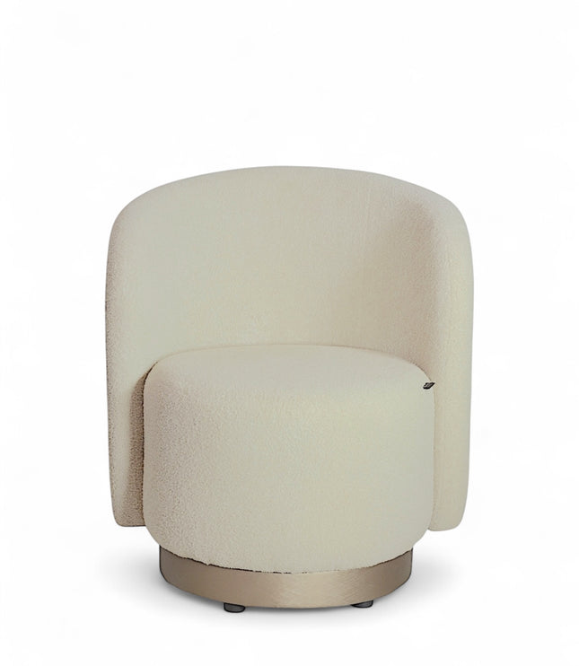 Modern boucle swivel lounge chair with off-white upholstery, curved backrest, and brass base by Vaya Home—ideal for contemporary living room or bedroom seating.
