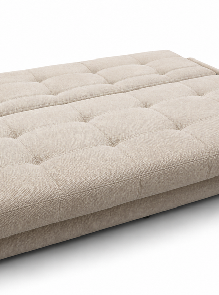 A beige tufted fabric sofa bed or daybed with a segmented, fold-out design, shown on a clean white background.