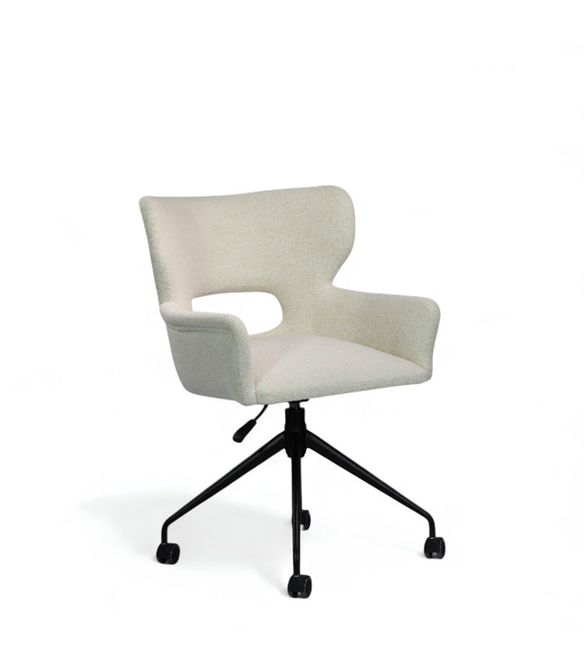 Wicky Swivel Chair in soft ivory boucle-style upholstery with sculptural cut-out backrest, flared arms, and black metal base on casters; shown in front three-quarter view.
