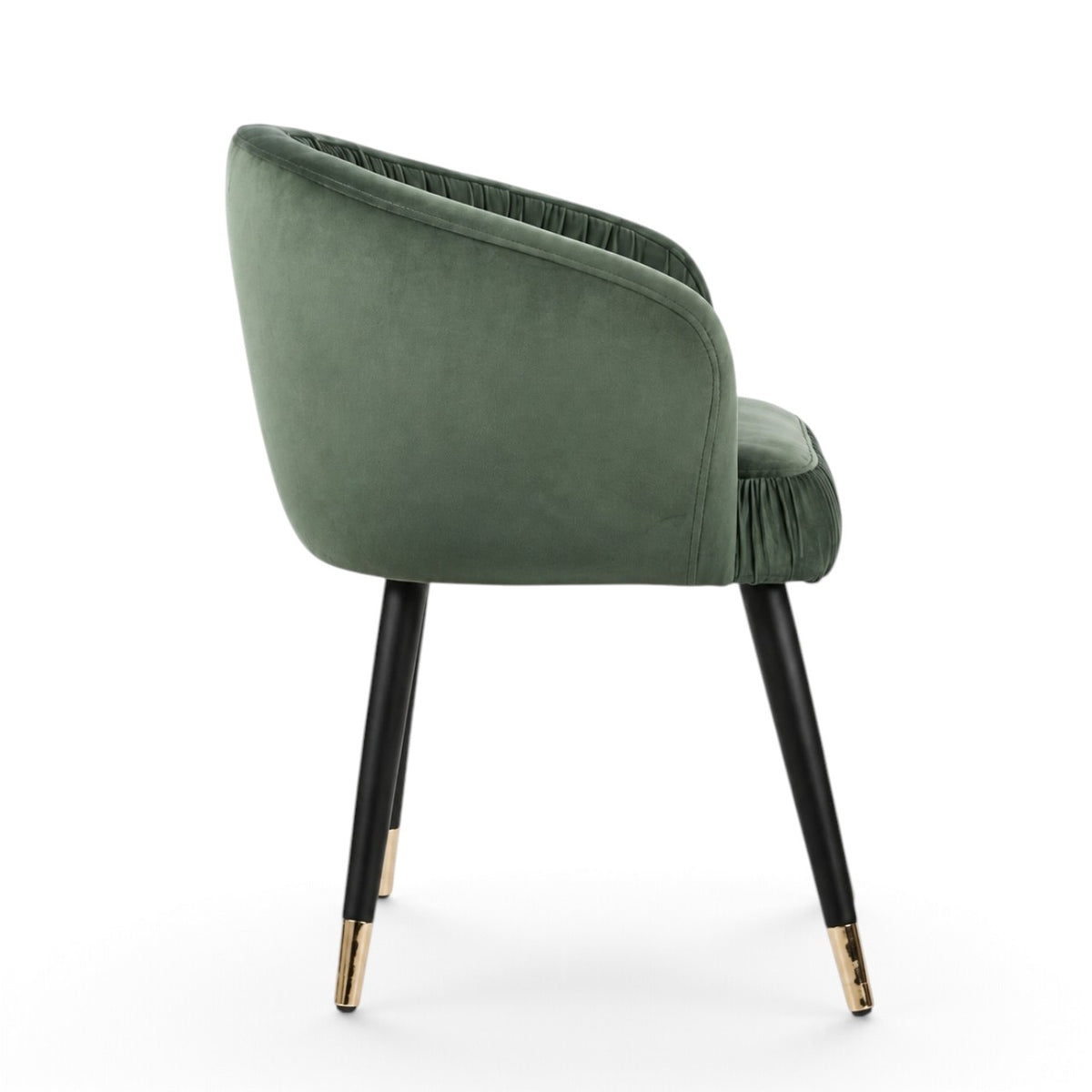 A green velvet barrel-style accent chair with black tapered legs and gold metal tips, shown against a plain white background.