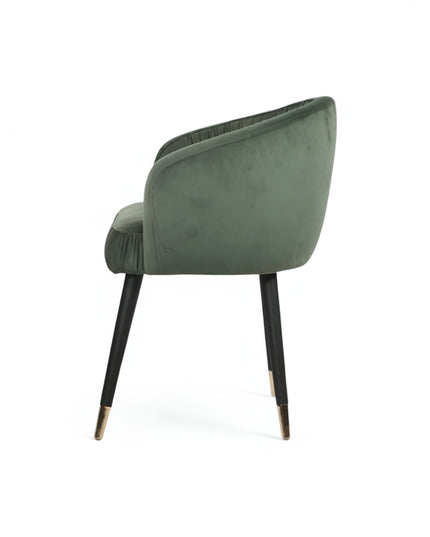 Modern forest green velvet barrel accent chair with pleated backrest and black metal legs with gold tips, perfect for living room or vanity seating.