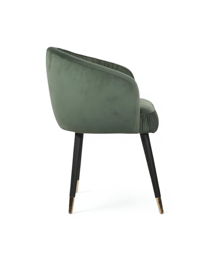 Modern forest green velvet barrel accent chair with pleated backrest and black metal legs with gold tips, perfect for living room or vanity seating.