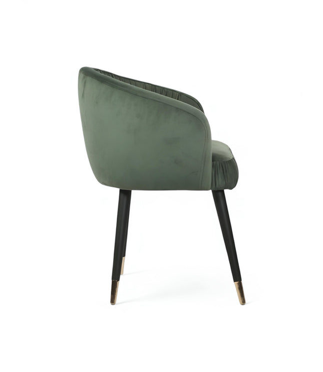 Modern forest green velvet barrel accent chair with pleated backrest and black metal legs with gold tips, perfect for living room or vanity seating.