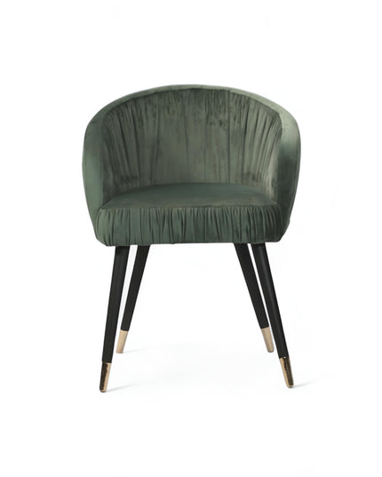 Modern forest green velvet barrel accent chair with pleated backrest and black metal legs with gold tips, perfect for living room or vanity seating.