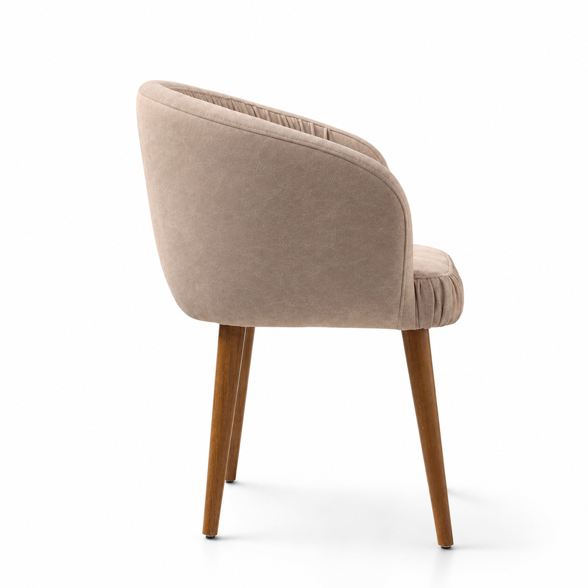 A modern barrel-style accent chair upholstered in a textured beige velvet fabric with a curved backrest and pleated detailing, supported by four tapered medium-brown wooden legs, shown on a clean white background.