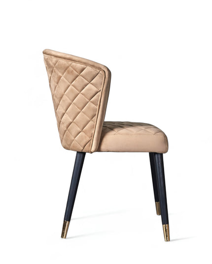 Elevate your interior with this diamond-stitched accent chair featuring a beige curved back, sleek black legs, and gold-tone accents—ideal for dining or vanity spaces.