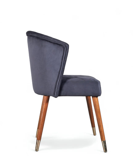 Elevate your interior with this diamond-stitched accent chair featuring a dark blue curved back, wooden legs, and gold-tone accents—ideal for dining or vanity spaces.