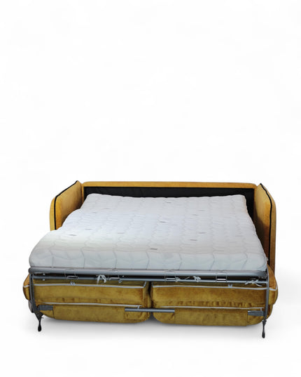Convertible mustard yellow upholstered sleeper sofa with button-tufted cushions and metal fold-out bed frame — modern multifunctional sofa bed for guest or small spaces