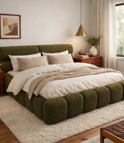Modern bedroom with a green upholstered bed and wooden furniture.