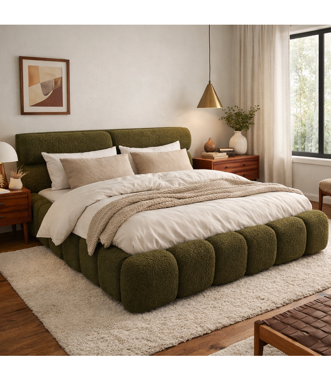 Modern bedroom with a green upholstered bed and wooden furniture.