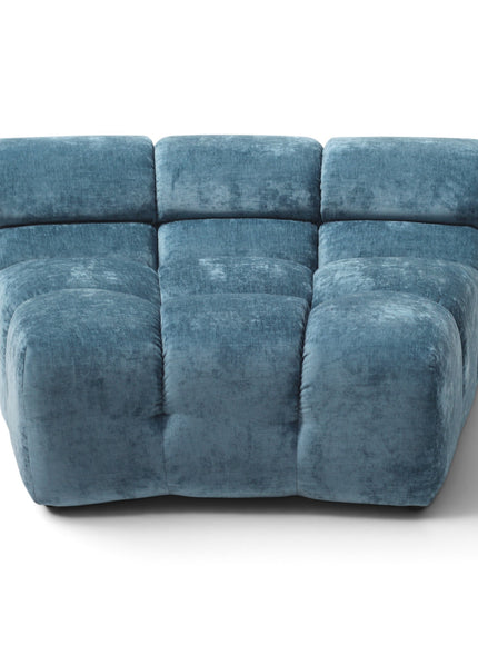 A modern modular three-seat sofa upholstered in textured blue velvet, shown from a front three-quarter angle on a clean white background.