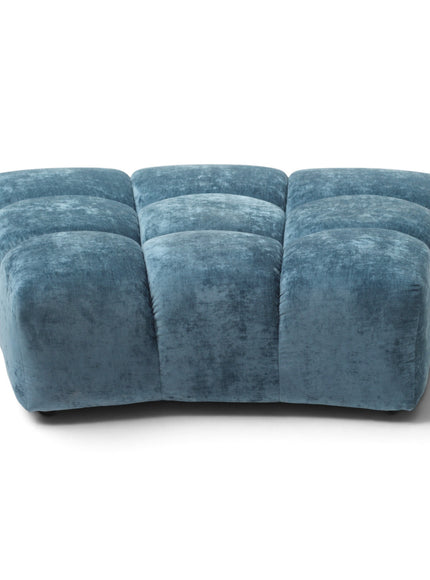 A modern three-seater ottoman upholstered in textured blue velvet, featuring a segmented, tufted block design, shown on a plain white background.