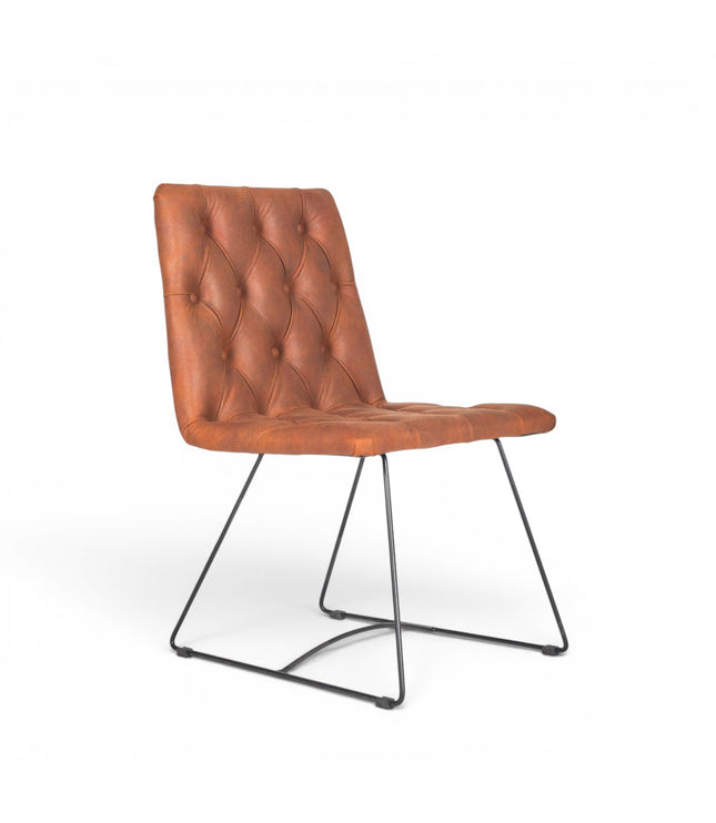 Vaya Home Hudson dining chair with brown faux leather upholstery, button-tufted seat and back, and black metal sled legs.