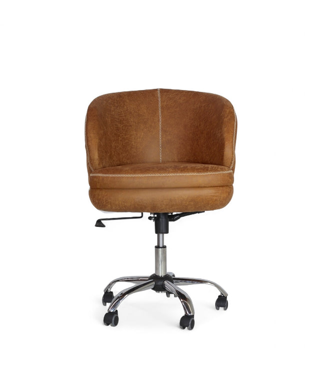 The Hugo Swivel Chair in Scotch velvet with curved backrest, plush seat, chrome swivel base, and tilt-lock mechanism on a neutral background.