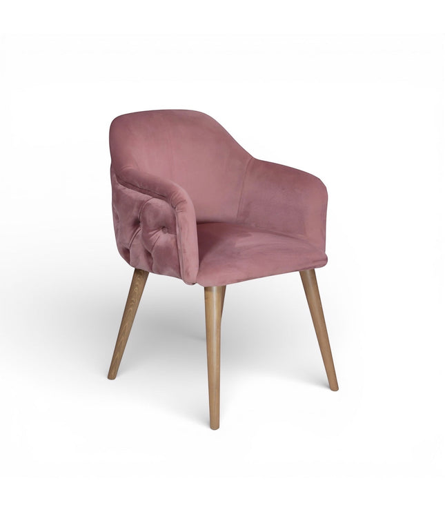 Pink velvet chair with wooden legs on a white background