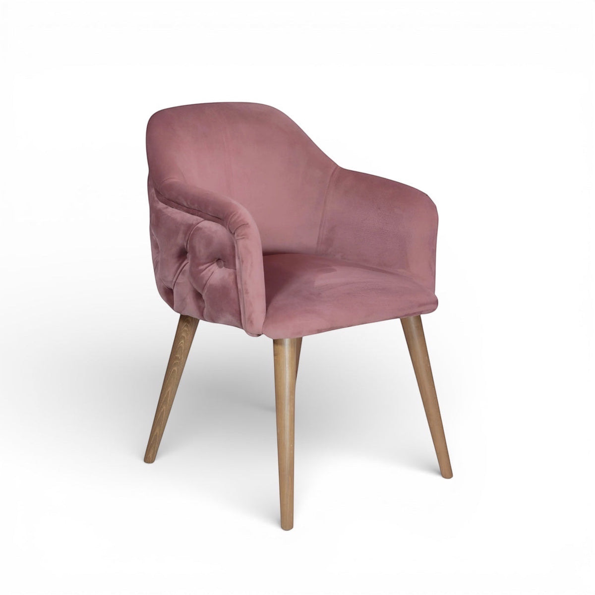 Pink velvet chair with wooden legs on a white background