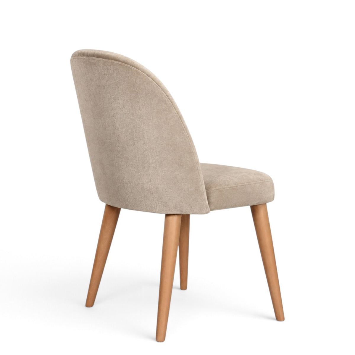 A modern dining chair with a curved backrest upholstered in light beige textured fabric, supported by four tapered natural wood legs, shown from a three-quarter angle on a white background.