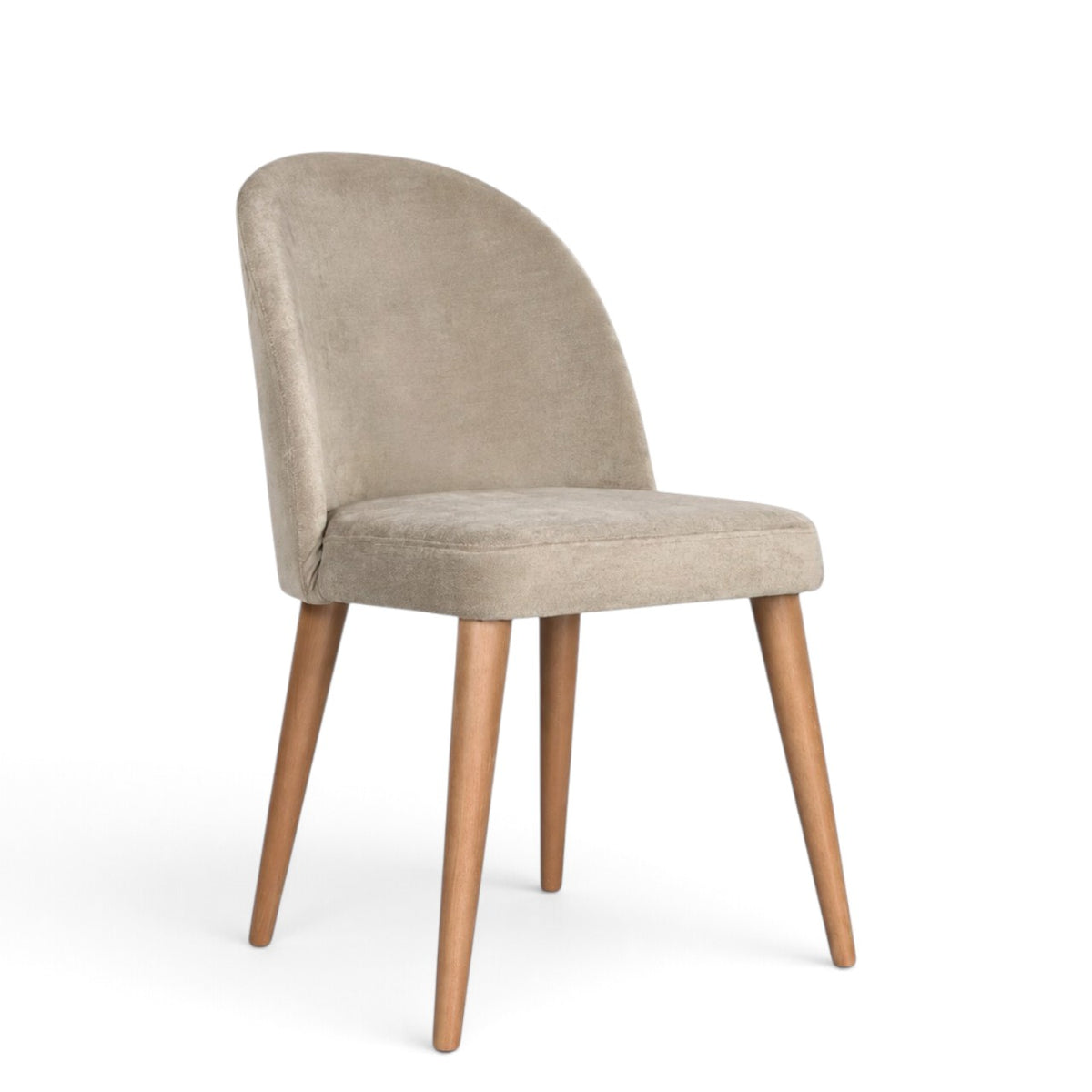 A modern dining chair with a curved backrest upholstered in light beige velvet, supported by four tapered natural wood legs, shown against a plain white background.