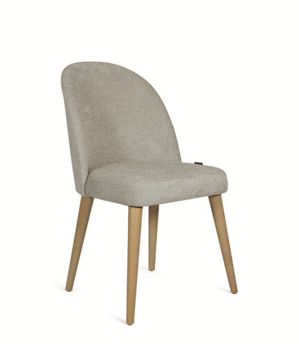 Contemporary beige chair with rounded backrest, cushioned seat, and tapered wooden legs