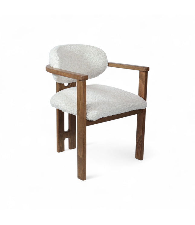 Mid-century modern dining chair with a solid wood frame and white boucle upholstered seat and curved backrest