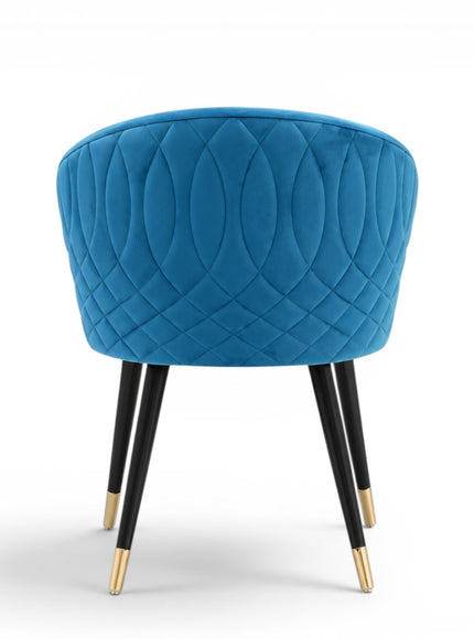 Blue quilted chair with black legs and gold tips on a white background