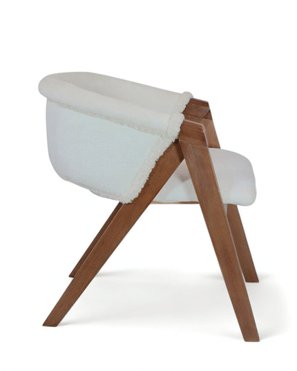 Modern white boucle accent chair with solid wood frame and angular legs — ideal for cozy interiors, Scandinavian spaces, or contemporary dining rooms. 