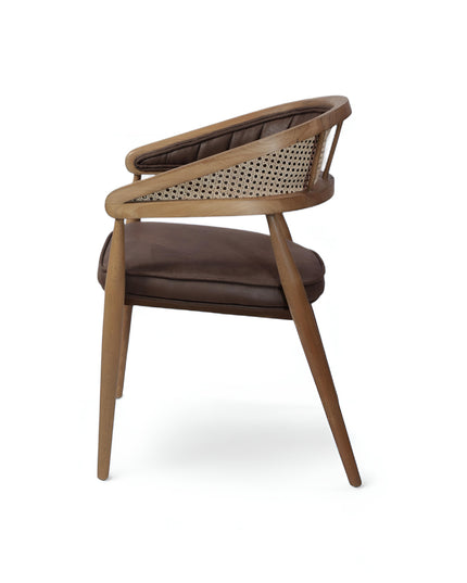 Mid-century modern accent chair with curved oak frame, woven cane side panels, and dark brown faux leather upholstery, ideal for dining rooms or stylish home offices.