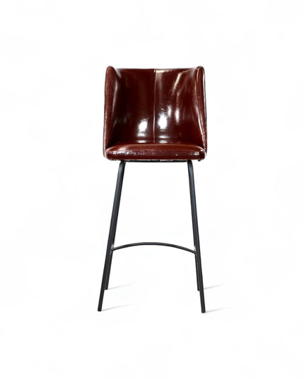 Modern bar stool with glossy dark brown faux leather upholstery, quilted side detailing, and slender black metal legs with a footrest, ideal for kitchen islands or contemporary home bars
