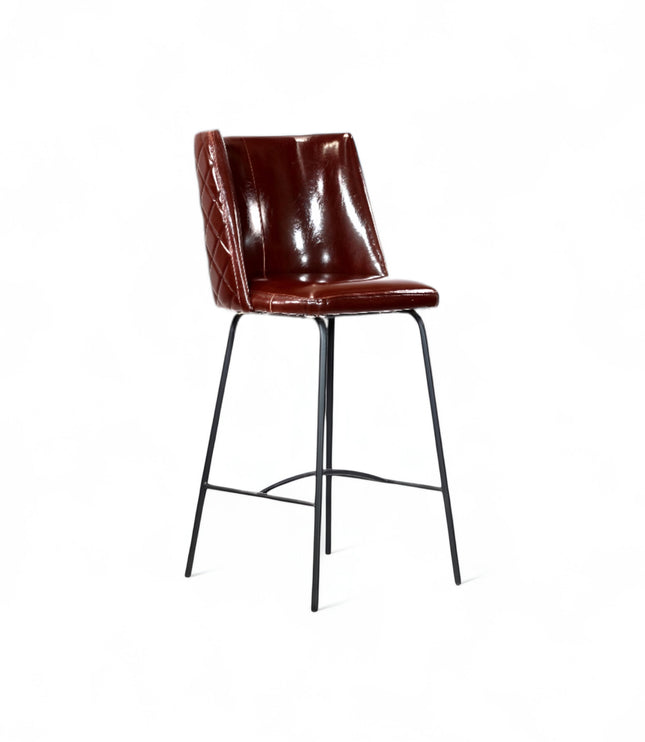 Modern bar stool with glossy dark brown faux leather upholstery, quilted side detailing, and slender black metal legs with a footrest, ideal for kitchen islands or contemporary home bars