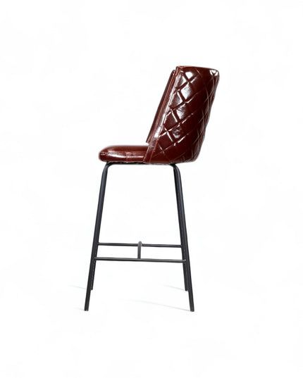 Modern bar stool with glossy dark brown faux leather upholstery, quilted side detailing, and slender black metal legs with a footrest, ideal for kitchen islands or contemporary home bars