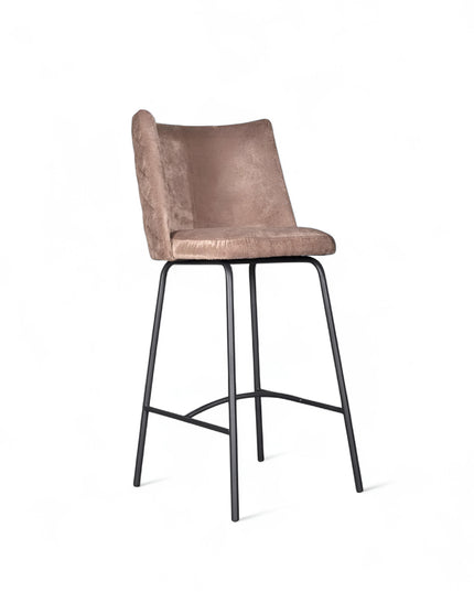 Modern bar stool with beige upholstery, quilted side detailing, and slender black metal legs with a footrest, ideal for kitchen islands or contemporary home bars