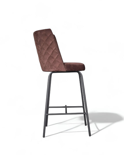 Modern bar stool with brown upholstery, quilted side detailing, and slender black metal legs with a footrest, ideal for kitchen islands or contemporary home bars