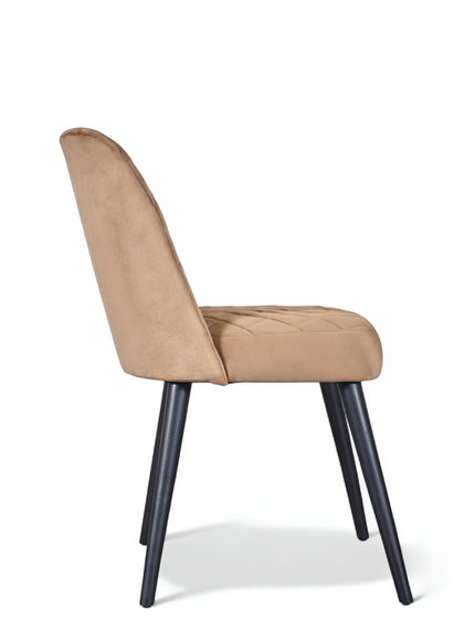 Modern armless beige dining chair with cushioned seat, curved backrest, and black metal legs