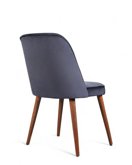 Modern armless dark blue dining chair with cushioned seat, curved backrest, and wooden legs