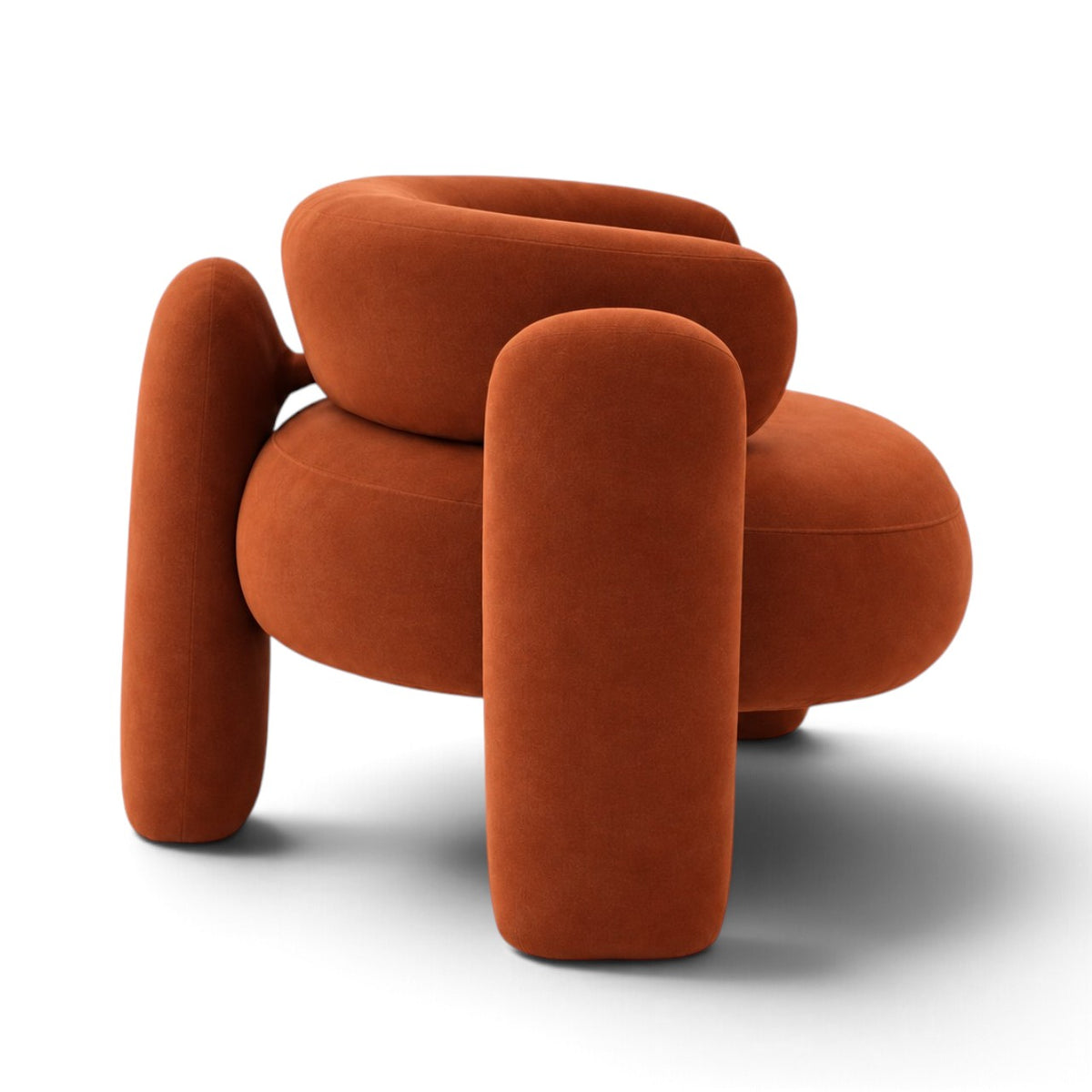 A modern, rounded accent chair upholstered in a textured burnt orange velvet fabric, shown from a front-facing perspective on a clean white background.