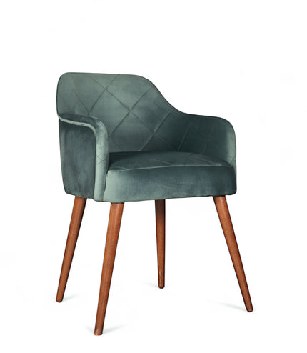 Upholstered green armchair with diamond stitching, enclosed sides, and tapered wooden legs