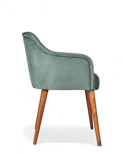 Upholstered green armchair with diamond stitching, enclosed sides, and tapered wooden legs