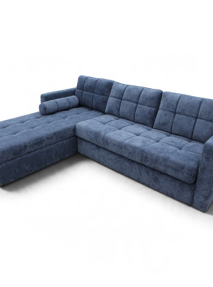 A modern L-shaped sectional sofa upholstered in textured blue fabric, featuring tufted button details on the chaise, backrest, and seat cushions, shown on a plain white background.