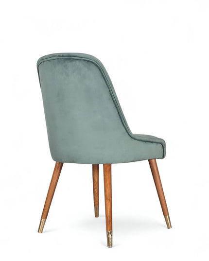 Modern dining chair with brue/gray curved backrest and angled wooden legs with golden tips