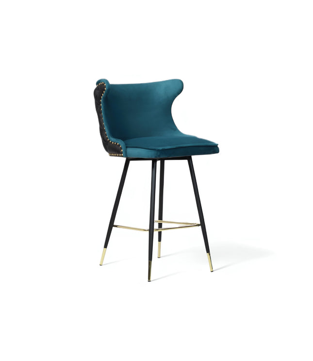 Modern bar stool with a sculpted teal velvet seat and high backrest, featuring black tufted faux leather on the outer back, brass nailhead trim, and slim black metal legs with gold accents and a footrest-ideal for kitchen islands or stylish bar areas