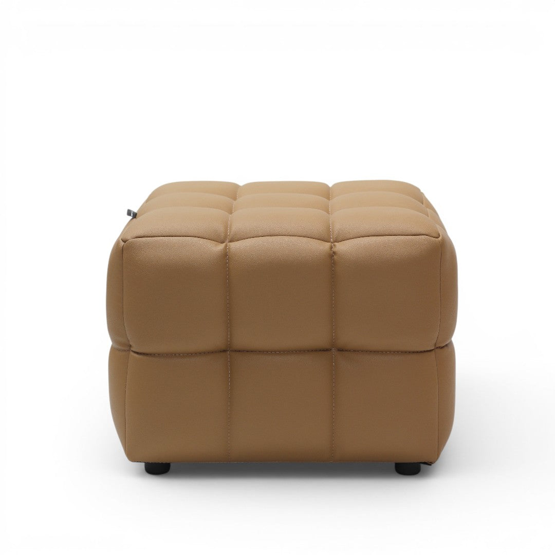 A square ottoman with a tufted grid pattern on a white background.