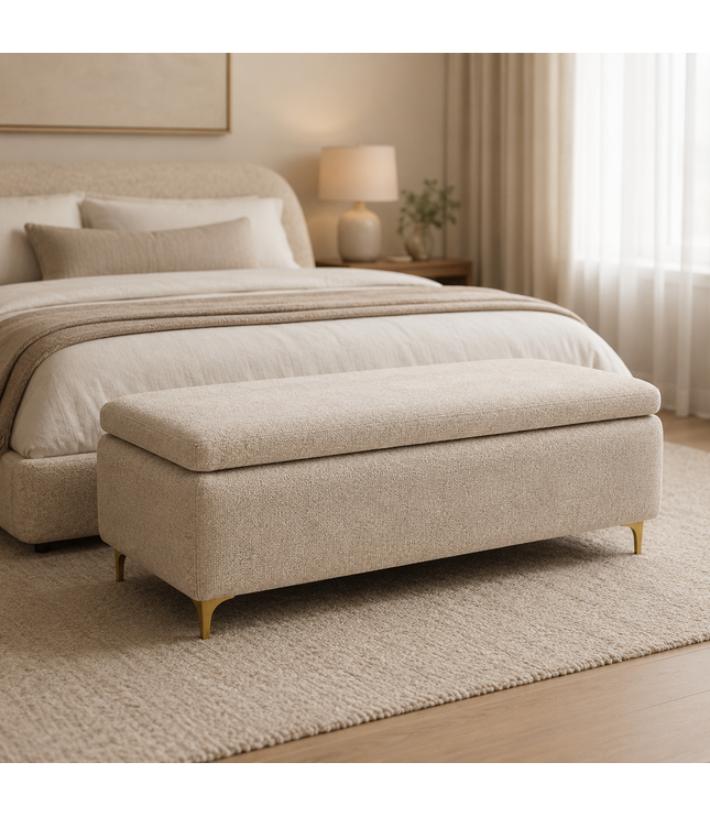 Beige upholstered bench in front of a bed in a bedroom setting