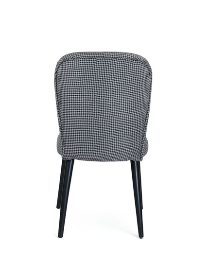 Contemporary dining chair with black and white houndstooth upholstery and tapered black legs — perfect for modern, minimalist, or Scandinavian interiors.