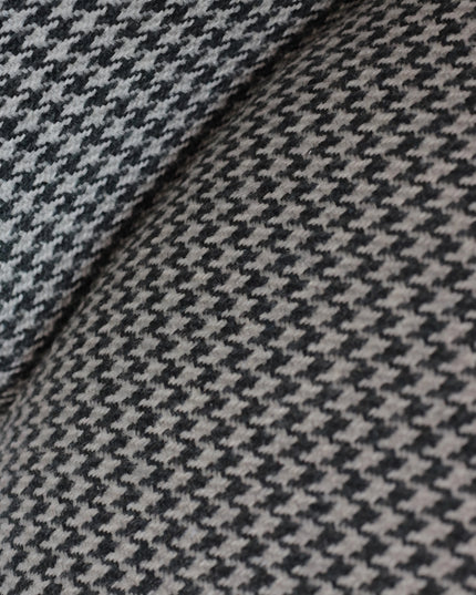 Contemporary dining chair with black and white houndstooth upholstery and tapered black legs — perfect for modern, minimalist, or Scandinavian interiors.