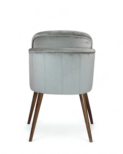 Modern dining chair with light grey diamond-stitched velvet upholstery and angled walnut wooden legs — ideal for contemporary interiors and luxury dining spaces.